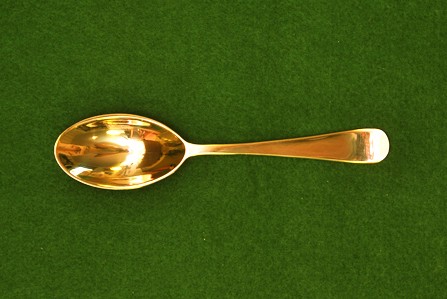 Brass spoon, oval bowl with rat tail and rounded tip